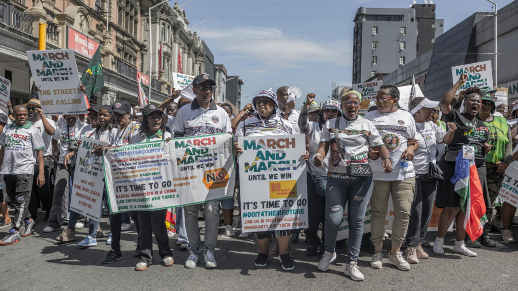 African migrants in the South African capital, Pretoria, were urged to exercise “heightened vigilance” during an anti-illegal immigration march, amid fears of xenophobic attacks.  Ghana’s high commission advised its nationals to close businesses and keep a “low profile”, while the head of the Nigerian Union of South Africa told its members to remain indoors. Another march is due on Wednesday in Johannesburg.  Anti-migrant sentiment has gained political currency in recent years with some believing foreigners are taking jobs and unfairly benefiting from public services.  But the president said citizens should not allow their concerns to “breed prejudices and hatred towards our fellow Africans”.  Condemning recent attacks on foreigners, President Cyril Ramaphosa used his Freedom Day address on Monday – marking the country’s first democratic elections in 1994 – to also remind his country of their debt to other nations on the continent in supporting their struggle against the racist system of apartheid.  On Tuesday, hundreds took to the streets of Pretoria in a protest organised by March and March, heading towards the Union Buildings, the official seat of the government.  Some wore T-shirts with slogans, while others chanted and held handmade signs.  One demonstrator told the BBC that the “influx of illegal immigrants” was why he was there, a matter he says politicians are not doing anything about.  “We are grateful that we now have groups like this that have come up to aid the voice of what we have always been preaching about – illegal immigration is a big problem to our society.”  Previous protests linked to immigration have sometimes escalated into violence, prompting calls for restraint and protection of vulnerable communities.  South Africa is home to about 2.4 million migrants, just less than 4% of the population, according to official figures. Most come from neighbouring countries such as Lesotho, Zimbabwe and Mozambique, which have a history of providing migrant labour to their wealthy neighbour.  Xenophobia has long been an issue in South Africa which has been accompanied by occasional outbursts of deadly violence BBC / Thuthuka Zondi Protesters. The man in the centre in holding up a sign, which reads: March and March until we win. If fighting for my country means I’m xenophobic then I’m proudly xenophobic.BBC / Thuthuka Zondi  Ghana’s diplomatic mission told Ghanaians in the country to “place the highest priority on personal safety… [and] take precautionary measures” during the protests.  The advisory on Tuesday “strongly encouraged” shop owners to close businesses, avoid areas where demonstrations are taking place, and not to take part in public gatherings that could “escalate into confrontation”.  Similarly, chairman of the Nigerian Union in South Africa, Olaniyi Abodedele, told members of his community to “close their shops… to be indoors and not go outside”.  “We are all very careful,” he told the BBC’s Pidgin service.  “We are in the dark because we don’t know how our government [in Nigeria] is going to react if any of us is to be affected or is to be killed.”  According to the Nigerian community leader, both Pretoria and Johannesburg have the “biggest” migrant communities.  “I’ve been harassed,” he told the BBC. “For us, it’s not about whether you are legal or not, and that is why everyone is very careful right now.”  “As long as you are a Nigerian, you are profiled and you are stereotyped immediately.” BBC / Thuthuka Zondi protesters in cultural headdresses and holding instrumentsBBC / Thuthuka Zondi Some protesters chanted and stopped for dances as they moved through the streets  A distance away from the march, the BBC spoke to some Nigerians in Pretoria.  One man, who had to close his shop, said he was not happy.  “It is not okay because we are blacks, we are brothers… everybody comes here just to survive”.  A security guard, who was unable to go to work because of the protest, told the BBC “it’s not what we expected as fellow Africans”.  “It’s just making us scared – imagine if we’re scared in our own African continent – what if we go to Europe?” he asked.  Speaking about xenophobia in South Africa, UN Secretary-General Antonio Guterres condemned what he called “criminal acts perpetrated by individuals inciting violence and exploiting socio-economic conditions”.  In remarks delivered by his spokesperson Stéphane Dujarric on Monday, he reminded South Africans of how their struggle against apartheid was “sustained through international and African solidarity”.  The UN chief said he was concerned by reports of “xenophobic attacks and acts of harassment and intimidation”, adding: “Violence, vigilantism and all forms of incitement to hatred have no place in an inclusive, democratic society.”  For more than a decade, the xenophobia directed at migrants has remained a political issue, especially as the country has one of the world’s highest unemployment rates at around 33%.  In recent years, the rise of ant-migrant groups such as March and March and Operation Dudula, have gained notoriety for their demands that foreign nationals be removed from the country.  In February, South Africa’s Zulu King Misuzulu kaZwelithini used a derogatory term for foreigners and said they should all leave, 11 years after his father urged migrants to “pack their belongings”.