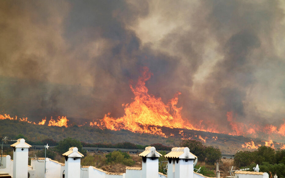 Flames approach the A7 highway during a deadly wildfire affecting the province of Almeria in Los Gallardos, Spain, July 10, 2026. REUTERS/Chema Artero