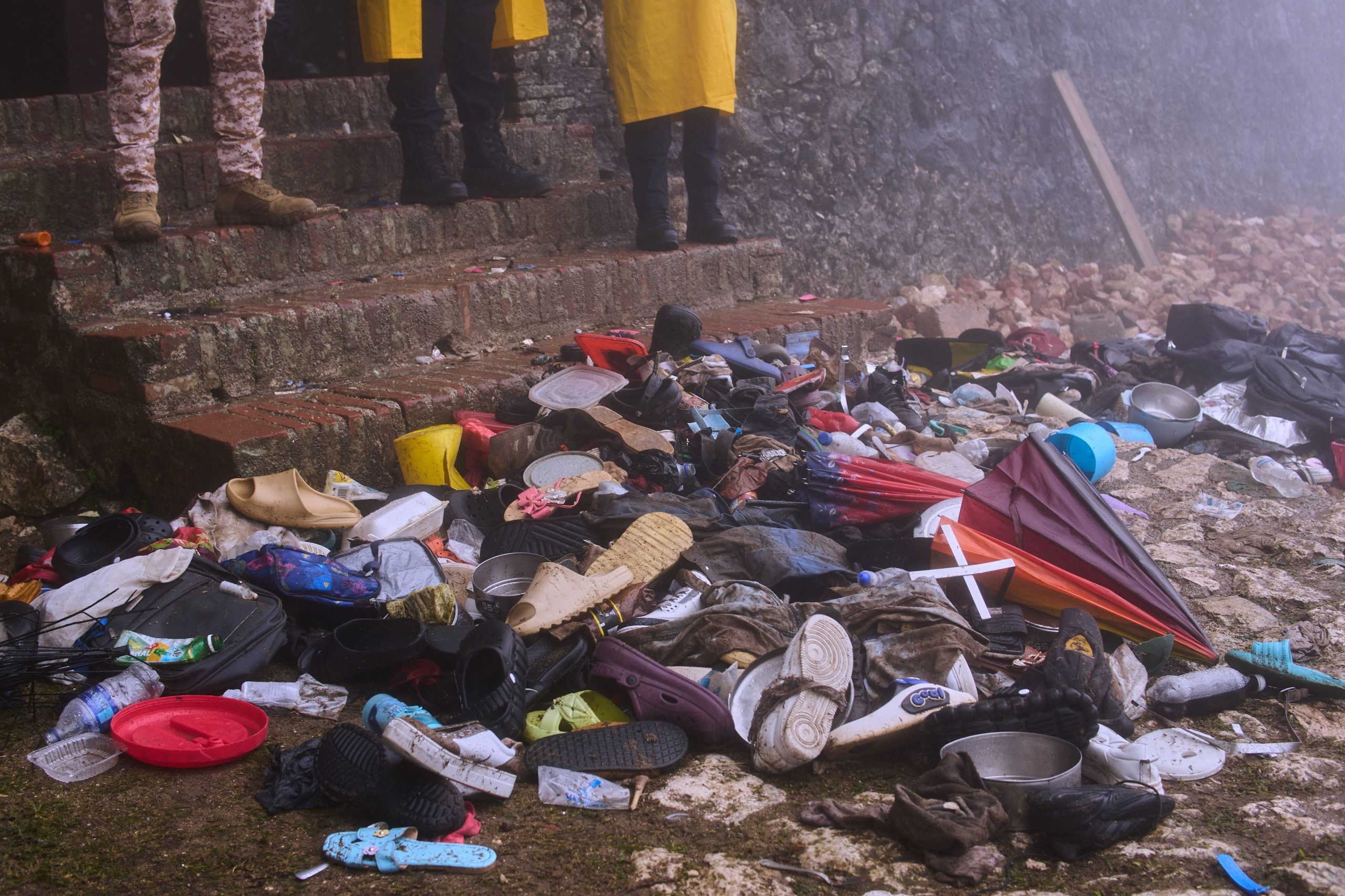 The shoes of victims of a deadly stampede sit by the main entrance of the Citadelle Laferriere in Milot, Haiti, Sunday, April 12, 2026. (AP Photo/Ketlain Difficile)