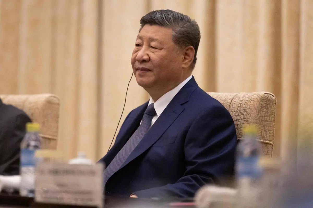 Chinese President Xi Jinping participates in a meeting with German Chancellor Friedrich Merz at the Diaoyutai State Guesthouse in Beijing on February 25, 2026. German Chancellor Friedrich Merz met with Chinese leader Xi Jinping in Beijing on February 25, hoping to bolster ties with his country's largest trade partner and high-tech rival as Europe's biggest economy struggles. (Photo by JESSICA LEE / POOL / AFP)